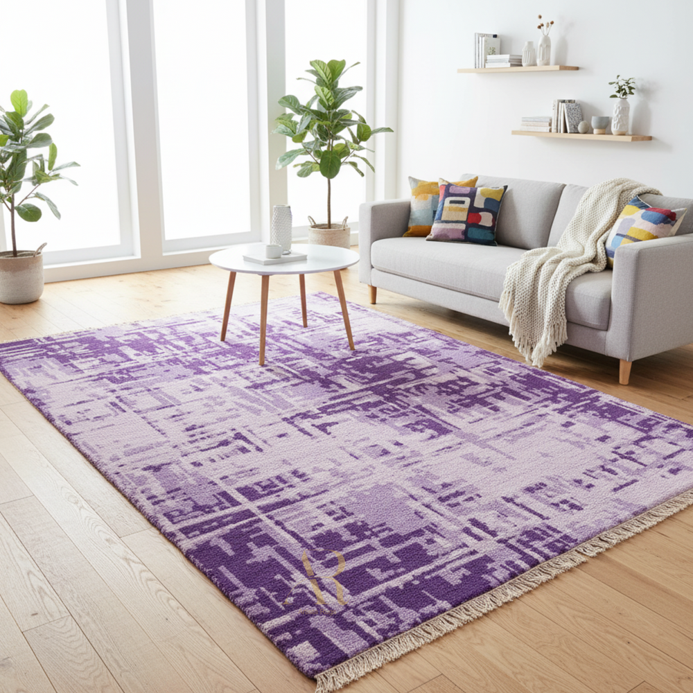 Living room with a purple patterned rug, gray sofa, and plants.