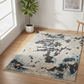 Camouflage-patterned rug on a wooden floor with a plant and framed picture in the background.