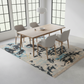 Dining room with a patterned rug, wooden table, and gray chairs.