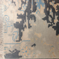 Close-up of a patterned rug with geometric design in neutral colors.