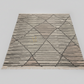 Geometric patterned rug on a plain background