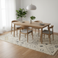 Dining room with wooden table and chairs on a patterned rug