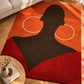 Decorative rug with a silhouette design on a wooden floor