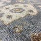 Close-up of a patterned rug with geometric design