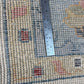 Rug with a ruler for scale showing its size