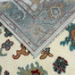 Close-up of patterned rugs with visible brand label
