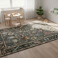 Decorative rug with intricate patterns in a room with a table and chairs.