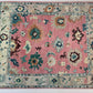 Decorative rug with floral patterns on a pink background