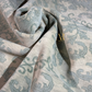 Textured fabric with a subtle pattern, possibly used for upholstery or decor.