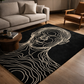 Black rug with white line art of a face in a living room setting