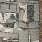 Geometric patterned rug with a mix of gray, black, and white colors on a wooden floor.