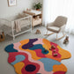 Colorful abstract rug in a nursery with baby furniture and toys.
