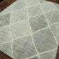 Patterned rug on a wooden floor