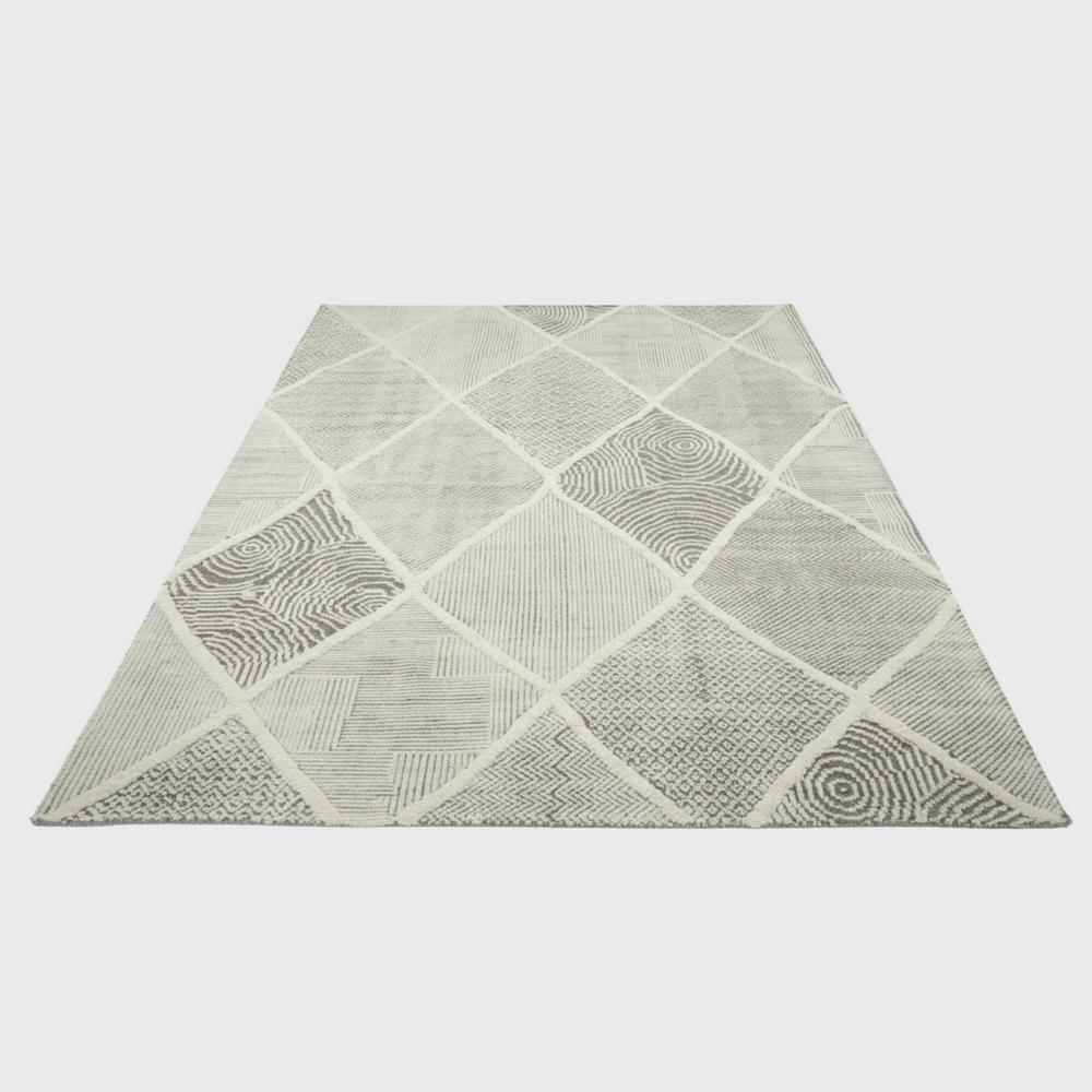 Geometric patterned rug on a plain background