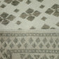Close-up of a patterned rug with geometric design