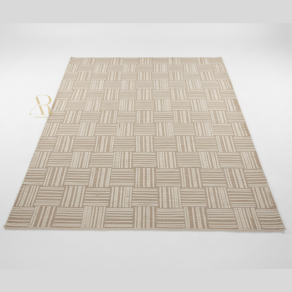 Beige woven patterned rug on a white background