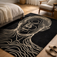 Black rug with white line art of a face in a living room setting
