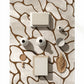 Decorative wall art with abstract patterns and ceramic elements on a textured surface.