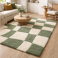 Living room with a checkered green and beige rug, sofa, and coffee table.