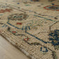 Close-up of a patterned rug with intricate designs on a wooden floor.