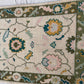 Close-up of a floral patterned rug with intricate designs.