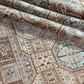 Close-up of a patterned rug with intricate designs.