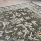 Patterned rug on a tiled floor