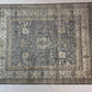 Decorative rug with intricate patterns on a plain background