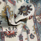 Close-up of a patterned rug with intricate designs.