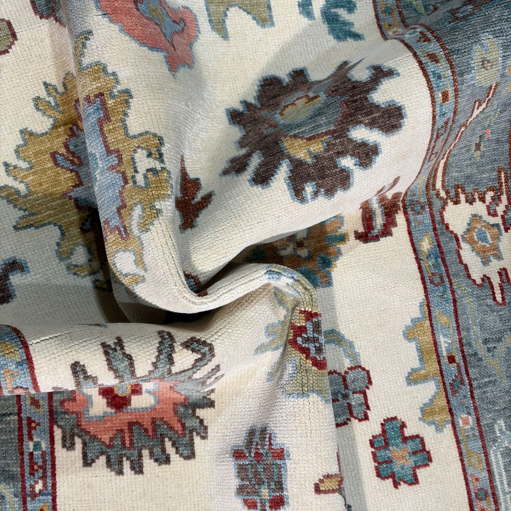 Close-up of a patterned rug with intricate designs.