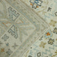 Close-up of a patterned rug with geometric and floral designs.