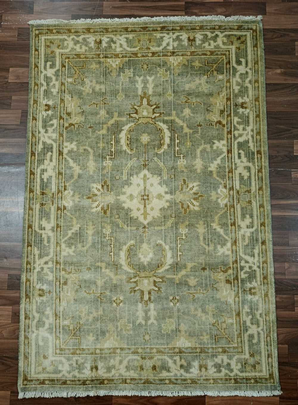 Decorative rug with intricate patterns on a wooden floor