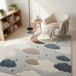 Living room with a cloud-patterned rug, bookshelf, and armchair.