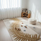 Children's room with a decorative rug featuring leaf patterns, toys, and a bookshelf.