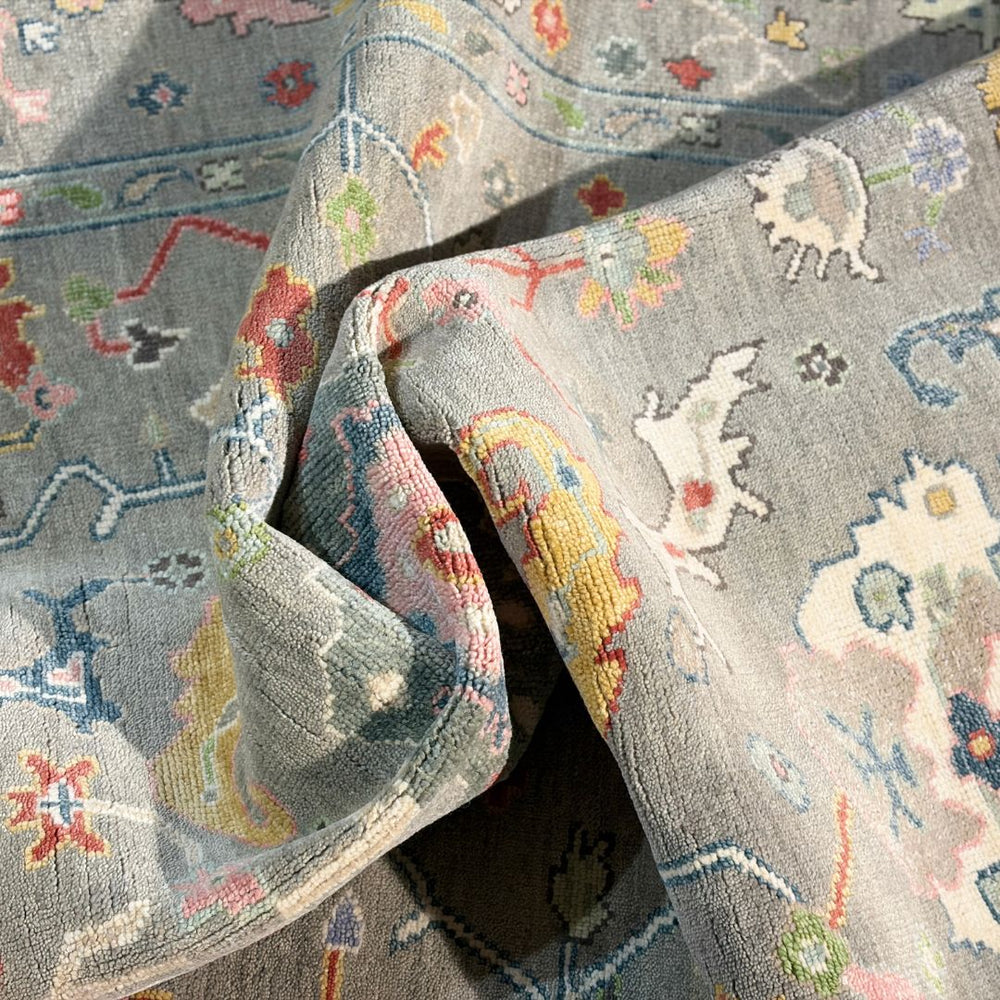 Close-up of a patterned rug with intricate designs in various colors.