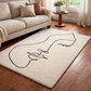 Beige rug with a black abstract design in a living room setting