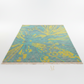 Rug with blue and yellow pattern on a white background