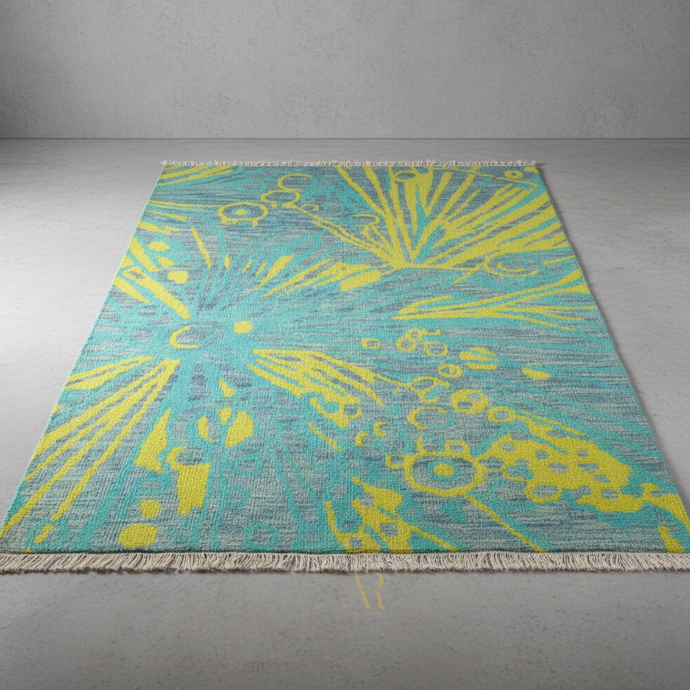 Teal and yellow patterned rug on a gray floor