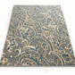 Decorative rug with intricate pattern on a white background