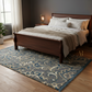 Bedroom with wooden bed, white bedding, and a decorative blue rug.