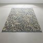 Decorative rug with paisley pattern on a plain background