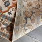 Close-up of a patterned rug on a tiled floor