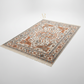 Decorative rug with intricate patterns on a light gray background