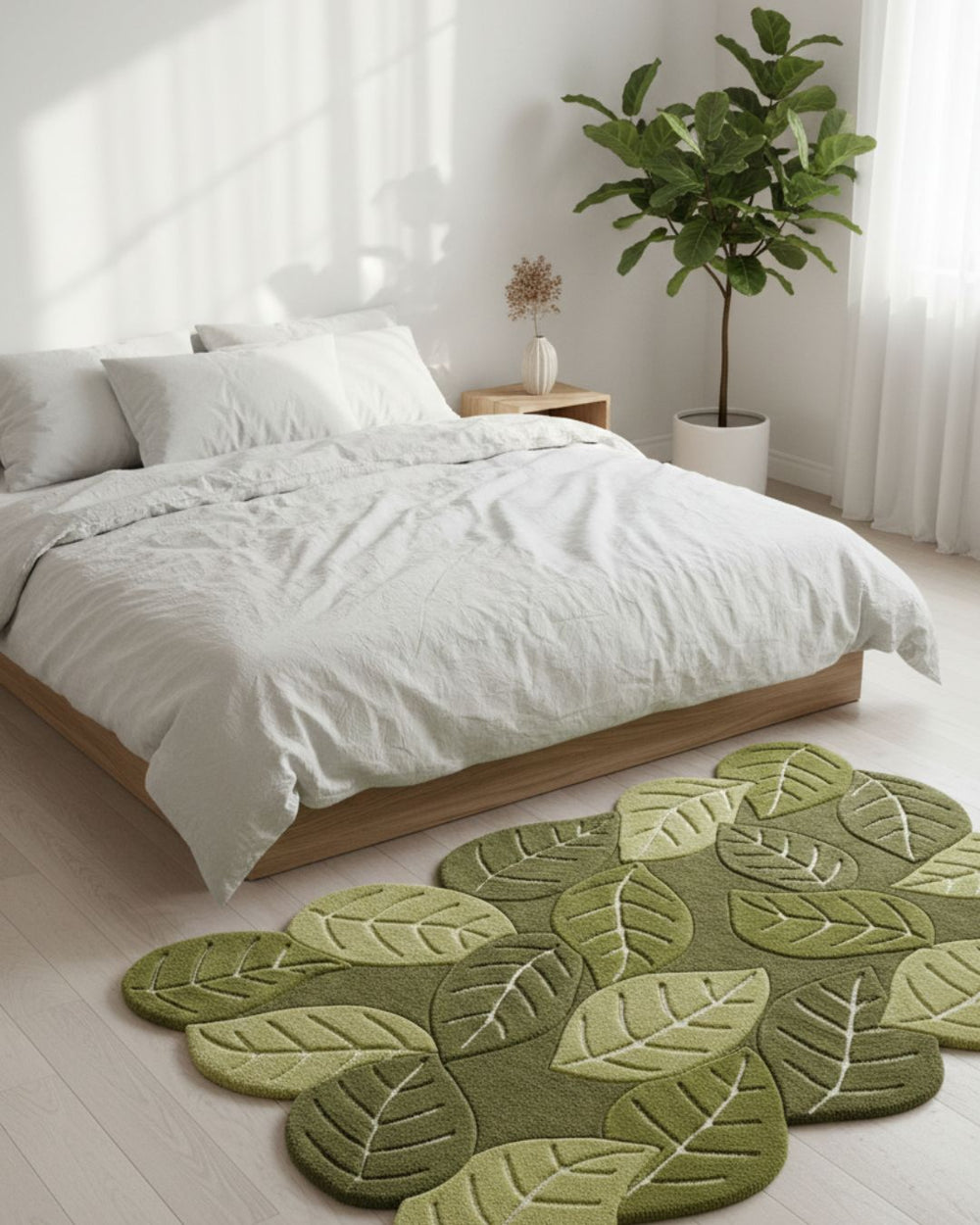 Green leaf-patterned rug in a bedroom with white bedding and a plant.