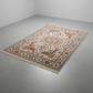 Decorative rug with intricate patterns on a plain floor