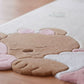 Children's rug with a bear design on a wooden floor