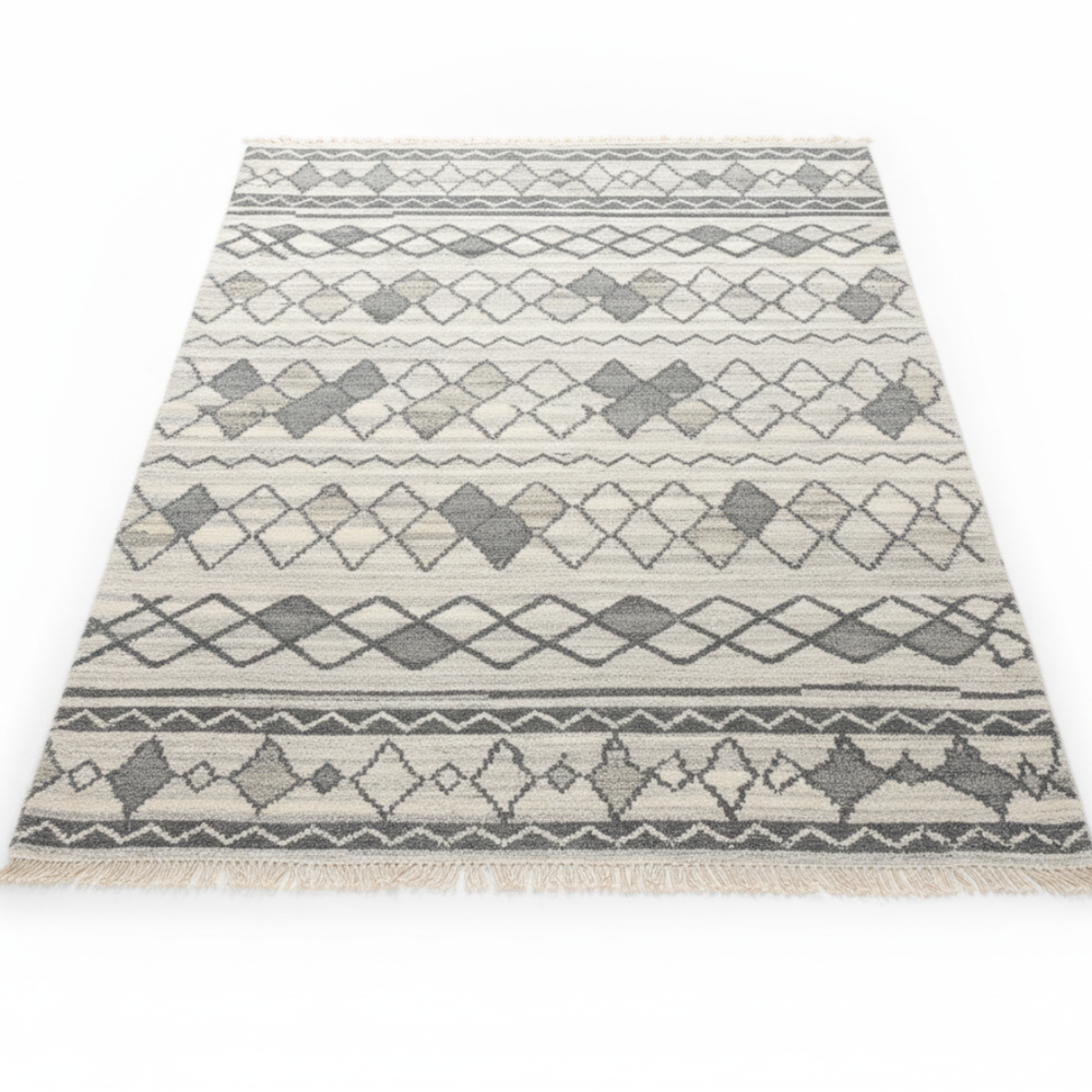 Patterned rug with geometric design on a white background
