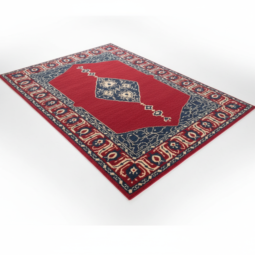 Decorative red and blue patterned rug on a white background