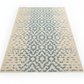 Beige rug with blue geometric pattern on a white background