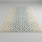 Beige and blue patterned rug on a plain background